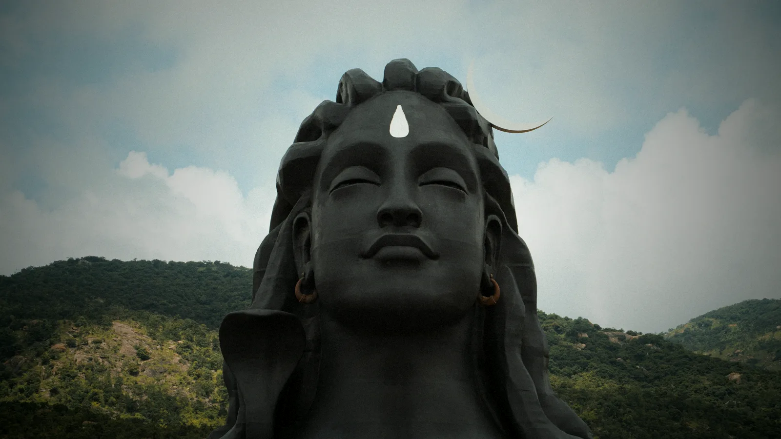 The serene face of the Adiyogi Lord Shiva statue with the crescent moon — the deity Jacob & Co. built the Epic X Mahadev Edition around