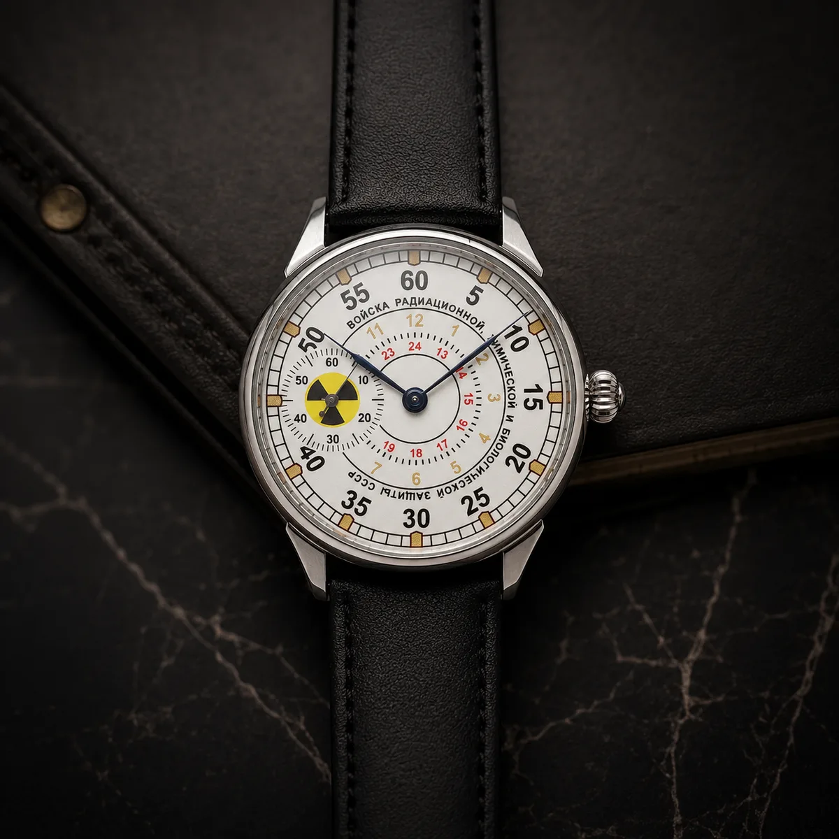 A Soviet Molnija radiation-protection watch with a yellow radioactive trefoil symbol on the dial and Cyrillic lettering for the USSR radiation-defence corps