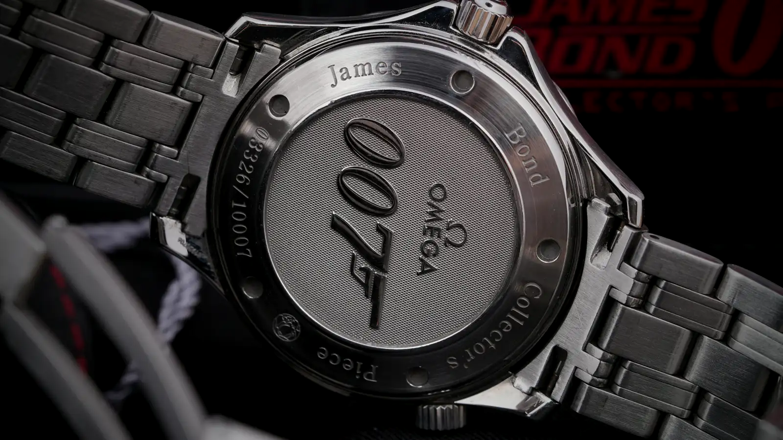 The steel caseback of an Omega Seamaster James Bond collector's edition, engraved with 007 and 'James Bond Collector's Piece,' on a dark background