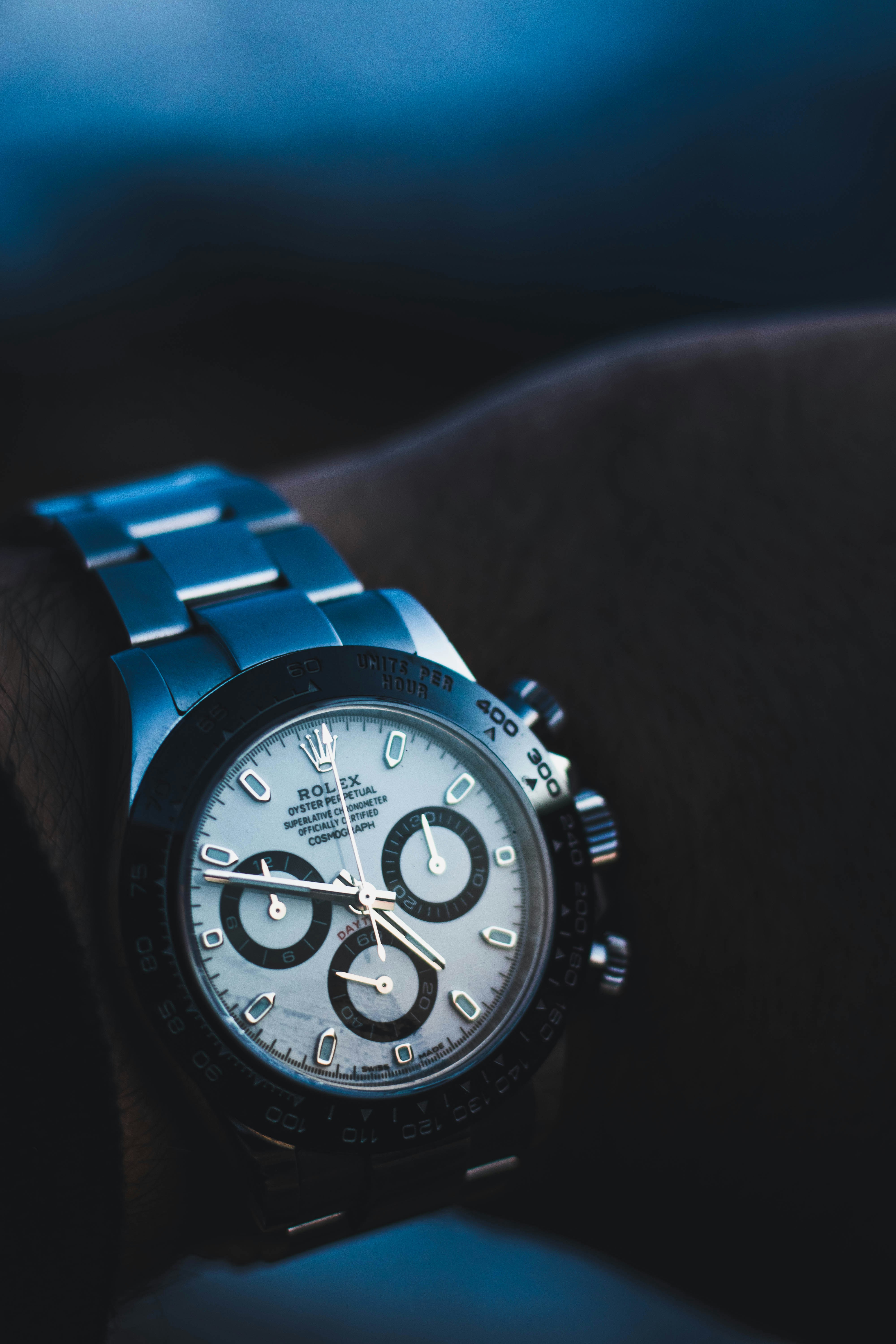 A Rolex Cosmograph Daytona with a white dial and black sub-dials